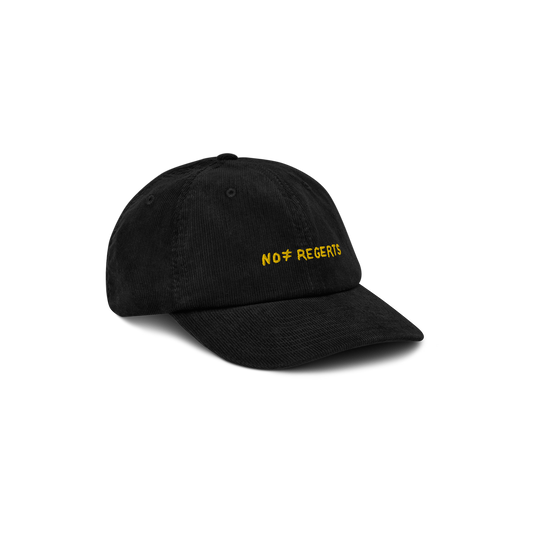 Right front view of the Black Corduroy Hat with "No Regerts" embroidered in yellow on the front